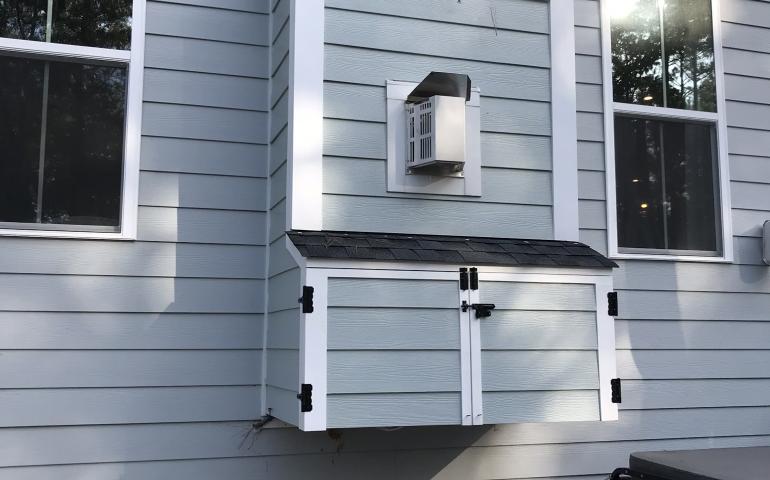 Custom outdoor TV enclosure with doors closed
